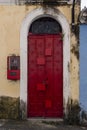 Antique door details in color with shadow, iron, cement, wood