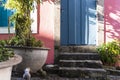 Antique door details in color with shadow, iron, cement, wood