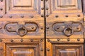 Antique door handle with a nice old wooden door detail Royalty Free Stock Photo