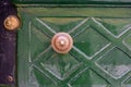 Antique door knob in old town. Classic brass door knob on green door vintage style