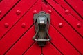 antique door lock on background of old red doors Royalty Free Stock Photo