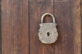 An antique door lock and brown wooden wall Royalty Free Stock Photo