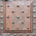 Antique door with wood and nails and studs-