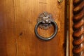 Antique doorknob in the form of a ring on an old door Royalty Free Stock Photo