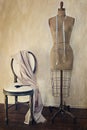 Antique dress form and chair with vintage feeling Royalty Free Stock Photo