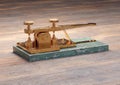 Antique electric telegraph machine isolated on wood table