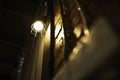 Antique electronic lamp, hanging at the red brick wall in the building.soft focus