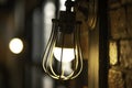 Antique electronic lamp, hanging at the red brick wall in the building.soft focus