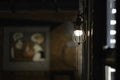 Antique electronic lamp, hanging at the red brick wall in the building.soft focus