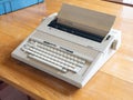 Antique electronic typewriter on a wood desk