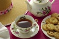 Antique elegant floral tea setting. English tea time.  Cup of tea with biscuits. Royalty Free Stock Photo