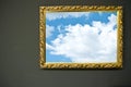 Antique empty golden frame on grunge wall with sky photograph Royalty Free Stock Photo