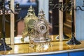 Antique expensive silver old clock on the chest of drawers Royalty Free Stock Photo