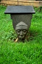 Antique face stone bench