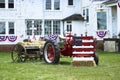 Antique farm Tractor with grain drill machine decorated with US flagasto celebrate Independence Day at Snyder`s Farm, Somerset, N