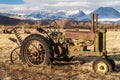 Antique farm tractor in mountain valley landscape Royalty Free Stock Photo