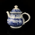 Antique figured teapot with hand painting.