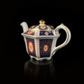 Antique figured teapot with hand painting.