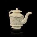 Antique figured teapot with hand-stucco.