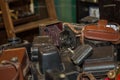 Antique Folding Camera with Bellows over a Pile of Old Cameras Royalty Free Stock Photo