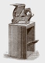 Antique foot treadle platen press on wood stand, in three-quarter front view Royalty Free Stock Photo