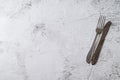 Antique fork and knife on white stone table