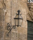 Antique gas iron lantern mounted on a stone brick wall Royalty Free Stock Photo