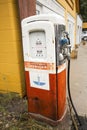 Antique gas pump near garage, Jackson, Wyoming.