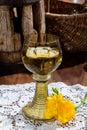 Antique German glassware, old Dutch style rummer or roemer glasses with white wine on white lace tablecloth Royalty Free Stock Photo