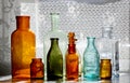 Antique glass bottles on a table Royalty Free Stock Photo