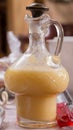 Antique glass decanter filled with egg liqueur Royalty Free Stock Photo