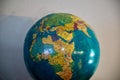 Antique globe featuring the map of the world, with various colors to represent land and sea Royalty Free Stock Photo