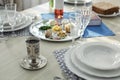 Antique goblet and plates on table served for Passover Pesach