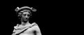 Antique god of commerce, merchants and travelers Hermes Mercury. Copy space. Ancient statue isolated on black background Royalty Free Stock Photo