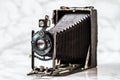 Antique Goerz Berlin, Compur Folding Camera on Marble Background