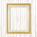 Antique gold frame on white wooden wall ;. Empty picture frame o Royalty Free Stock Photo