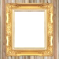 Antique gold frame on wooden wall background Royalty Free Stock Photo