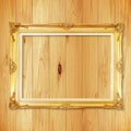 Antique gold frame on wooden wall Royalty Free Stock Photo
