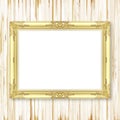 Antique gold frame on wooden wall Royalty Free Stock Photo