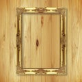 Antique gold frame on wooden wall Royalty Free Stock Photo