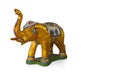 Antique gold mirror color elephant standing on green ground, on white background, object, animal, statue, copy space Royalty Free Stock Photo