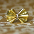 Antique golden bow brooch with diamonds Royalty Free Stock Photo