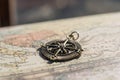 Antique golden compass on a vintage map, travel background Royalty Free Stock Photo