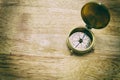 Antique golden compass on wood table. concept for direction, travel, guidance or assistance Royalty Free Stock Photo