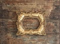 Antique golden frame on used wooden background. Rustic texture Royalty Free Stock Photo