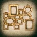 Antique golden frames over grungy wall background Royalty Free Stock Photo