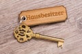 Antique golden house key on keyring Royalty Free Stock Photo