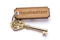 Antique golden house key on keyring Royalty Free Stock Photo