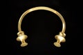 Antique golden torc. Rigid neck ring or bracelet from celtic culture