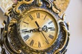 Antique goldish clock. Royalty Free Stock Photo